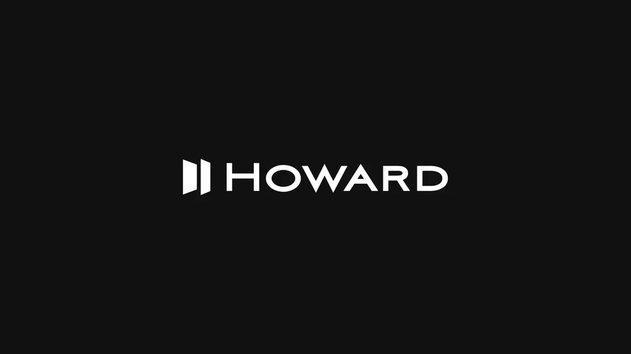 Howard wordmark and symbol over a city skyline