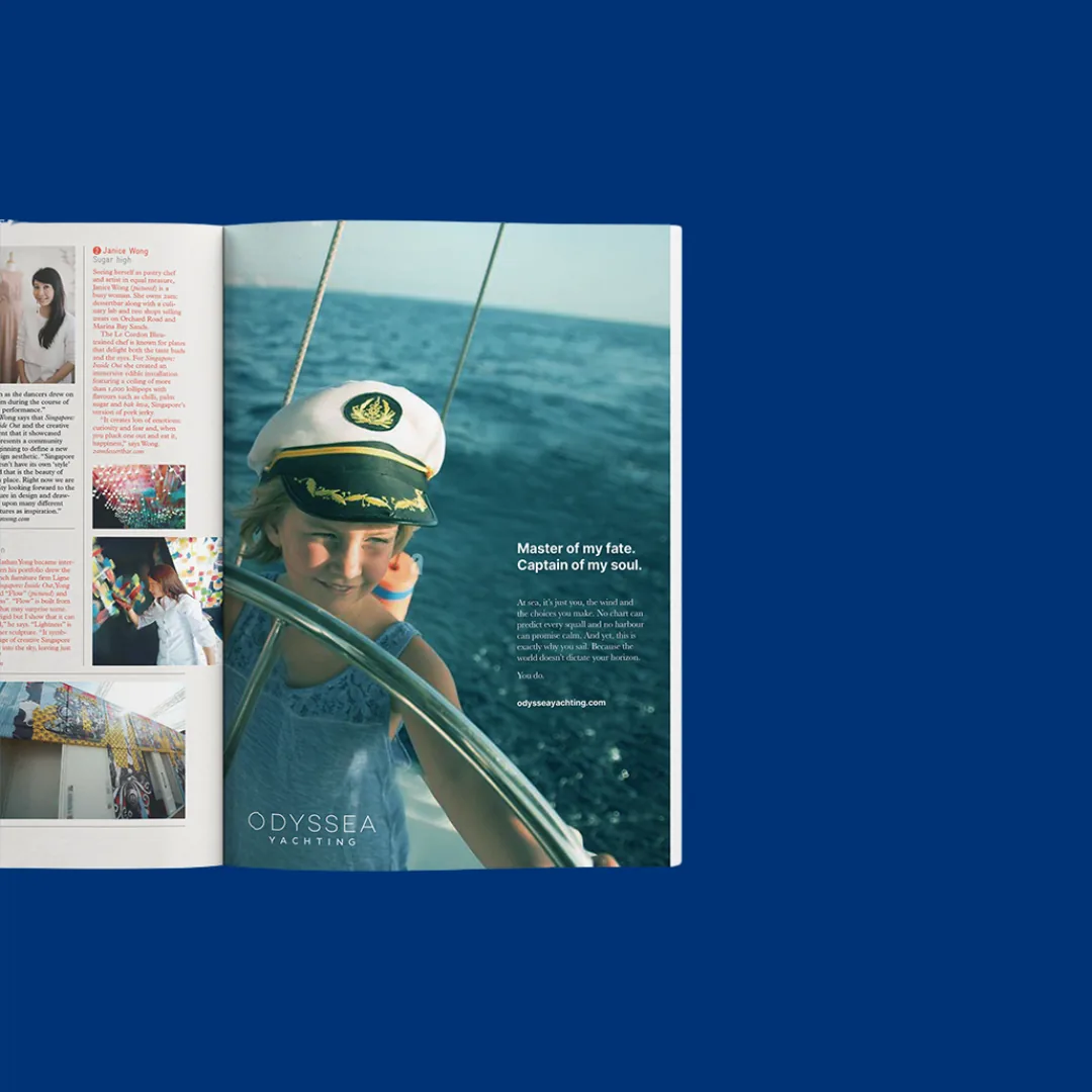 Odyssea Yachting press advertisement on a magazine spread